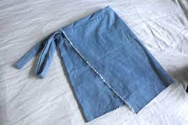 asymmetrical frayed hem wrap skirt